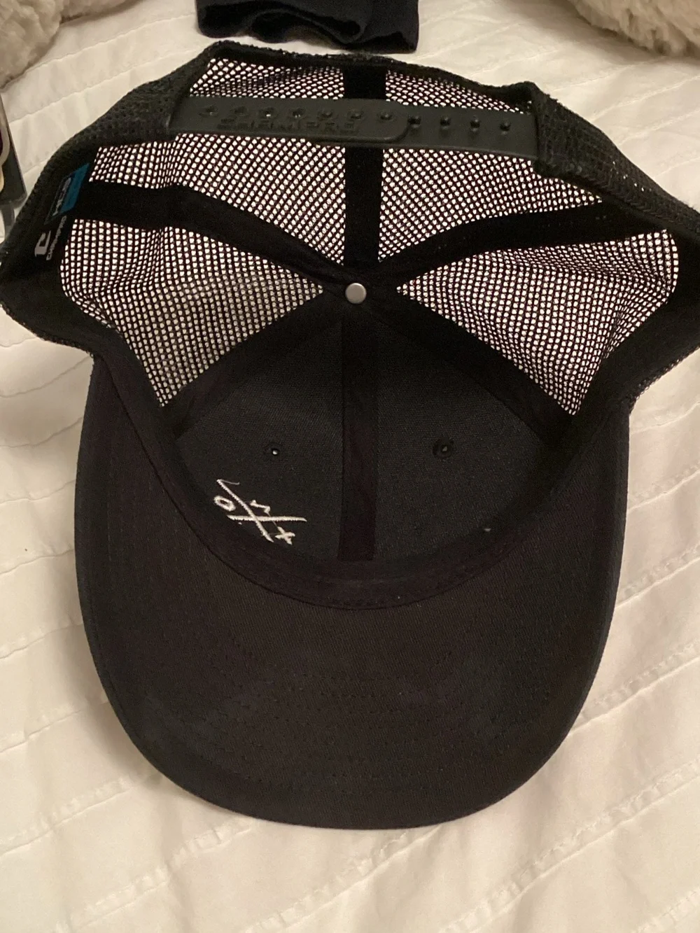 Black Mesh Trucker Cap with White Crossed Letter Accent